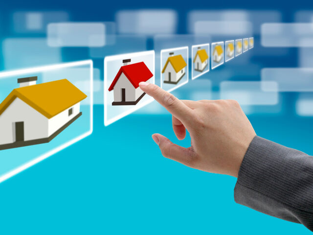 man hand Finding new property in real estate market with electro