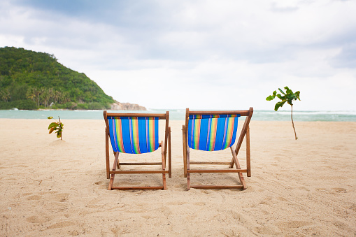 Beach chairs at sea front, Koh Phangan, Thailand